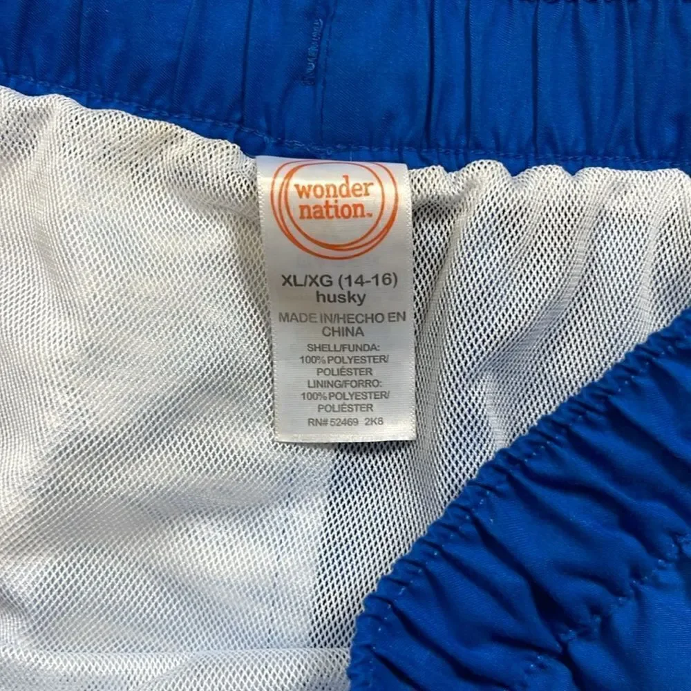 Wonder Nation swimming shorts. Drawstring waist. Size XL (14/16). Pockets.
